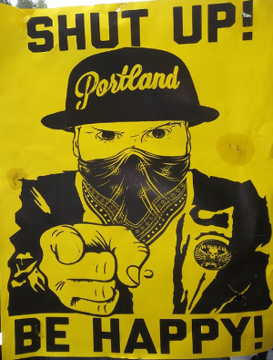 Poster on racism protests & riots snatched from post in Hollywood District, Portland, OR